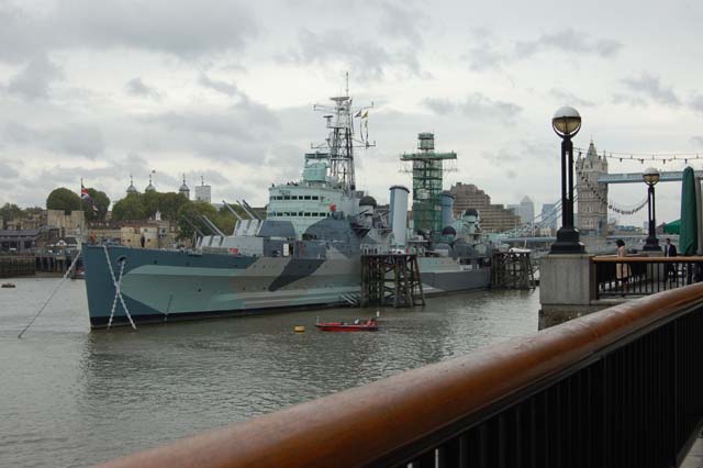 The large grey battle ship, HMS Belfast, is moored on the river near Tower Bridge and is open as a museum.