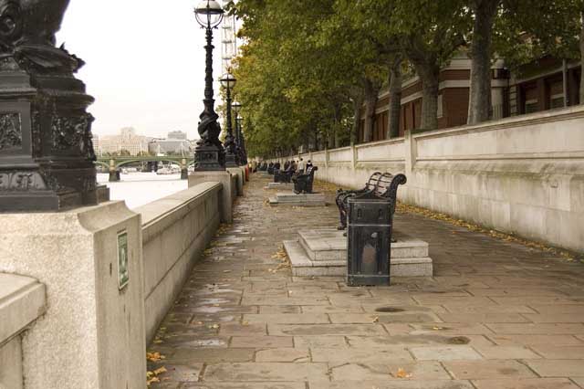 The picture shows the raised benches along the Thames Path, overlooking the river, with the London Eye showing in the distance.